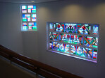 Glas-in-loodramen van Jacoba van Heemskerck, ontwerp uit 1921.
<br/>
Foto-archief GGD Amsterdam, 2010